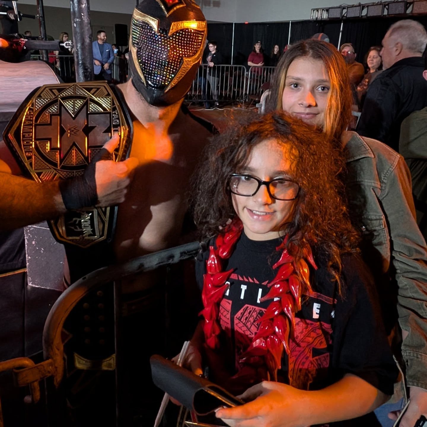 Trystan and another young fan meet a masked NXT champion at ringside