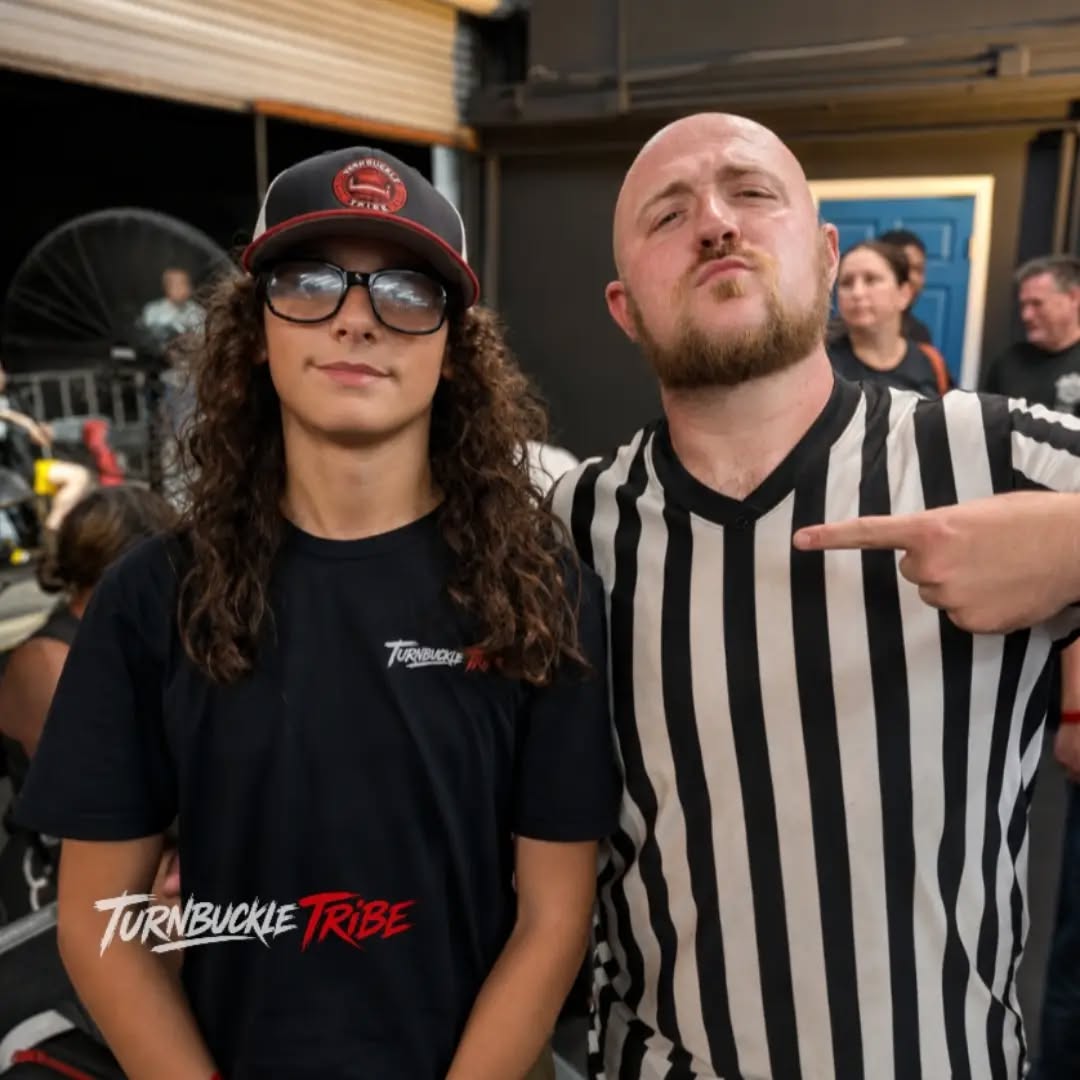 Trystan poses with a wrestling referee