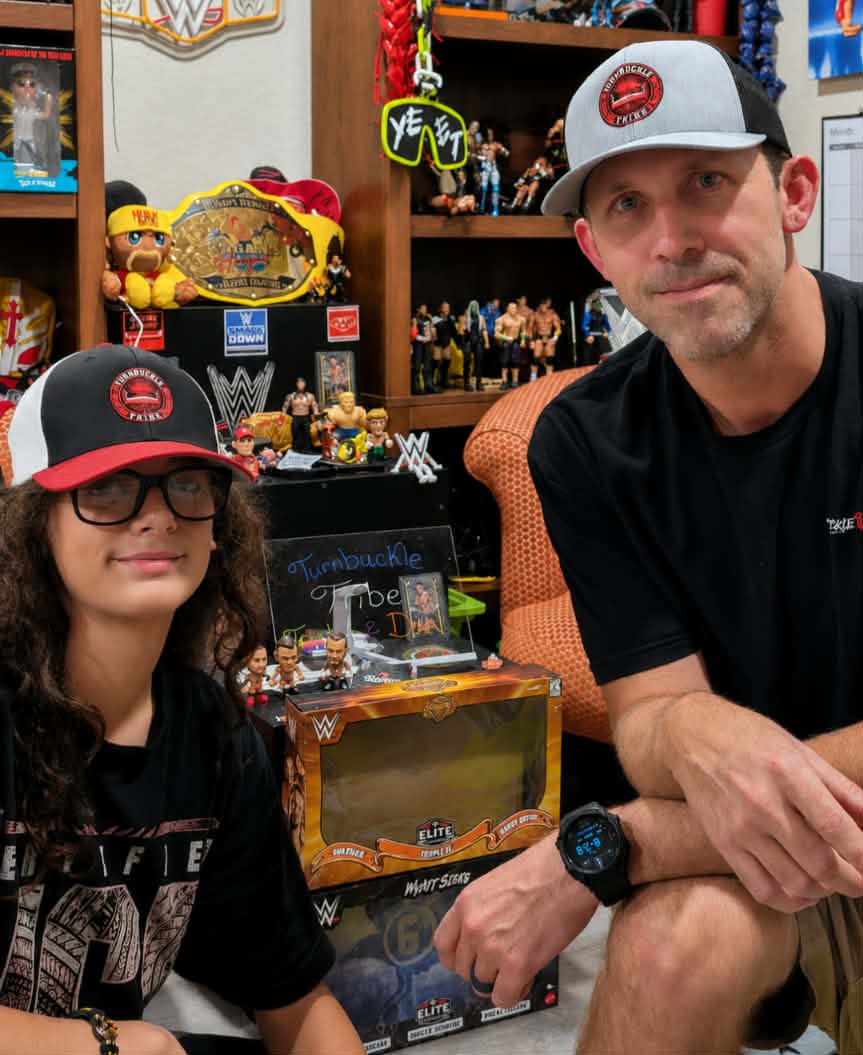 Turnbuckle Tribe family members with a wrestling memorabilia collection